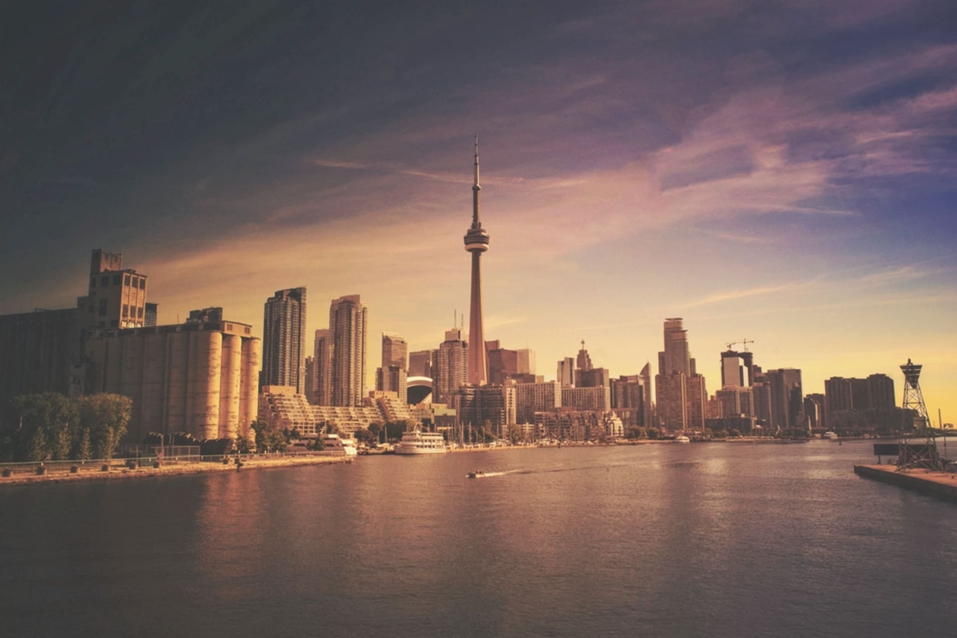 Toronto skyline and the CN Tower at sunset over Lake Ontario